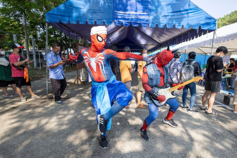 Campaigners in Spider-Man costume perform to encourage people to vote on the general election day in Bangkok, Thailand, Sunday, May 14, 2023. Voters in Thailand were heading to the polls on Sunday in an election touted as a pivotal chance for change, eight years after incumbent Prime Minister Prayuth Chan-ocha first came to power in a 2014 coup. (AP Photo/Wason Wanichakorn)