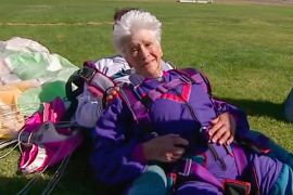 In this image made from video, Clare Nowland reacts following her skydive in Canberra, Australia