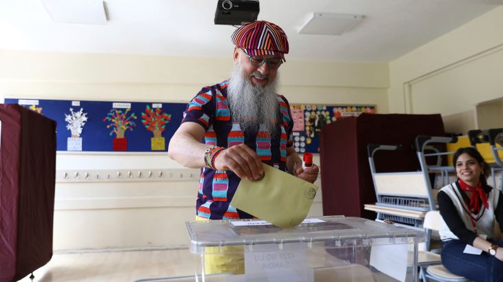 A man votes at a polling station in Ankara