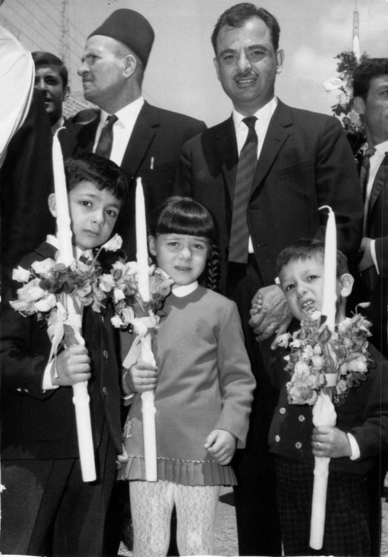 A Greek Orthodox father and his three children, on Palm Sunday, in 1960s Jerusalem [Photo courtesy BMJ]