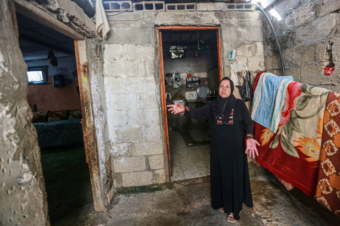 Rola al-Aqra’, 45, from Deir al-Balah in the central Gaza Strip, says repeated damages made her house unfit for habitation, and greatly affected her children_s psyche_-1683179260