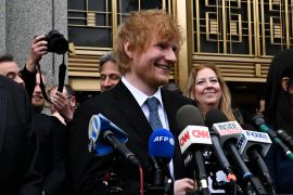 Ed Sheeran smiling as he speaks to the media outside court after the jury found in his favour.