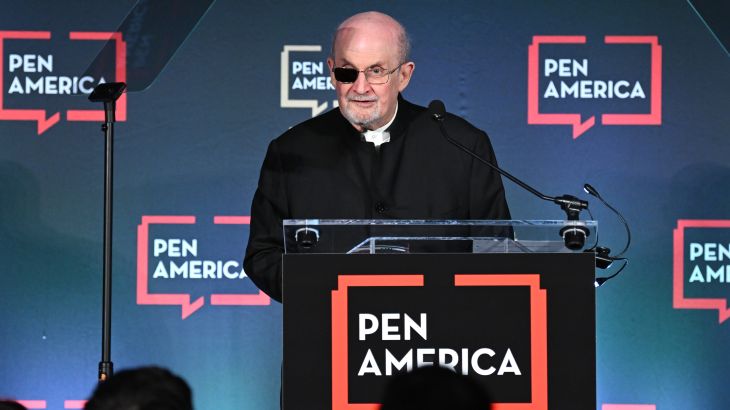 Salman Rushdie speaks on stage at the 2023 PEN America Literary Gala at American Museum of Natural History