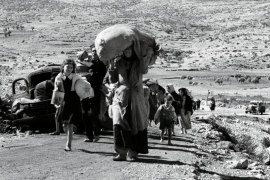 Palestinians carry their possessions, as they flee from there homes in Al-Jalil in 1948 [File: Reuters]