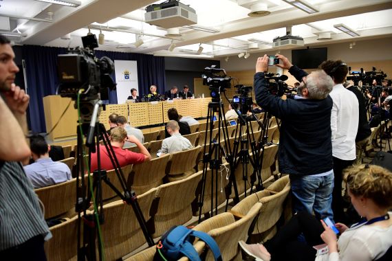 Media attend a press conference held by the Swedish Prosecution Authority in Stockholm