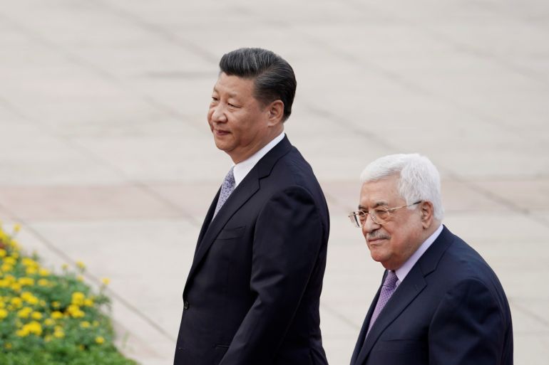 President Xi Jinping and President Mahmoud Abbas walking in Beijing