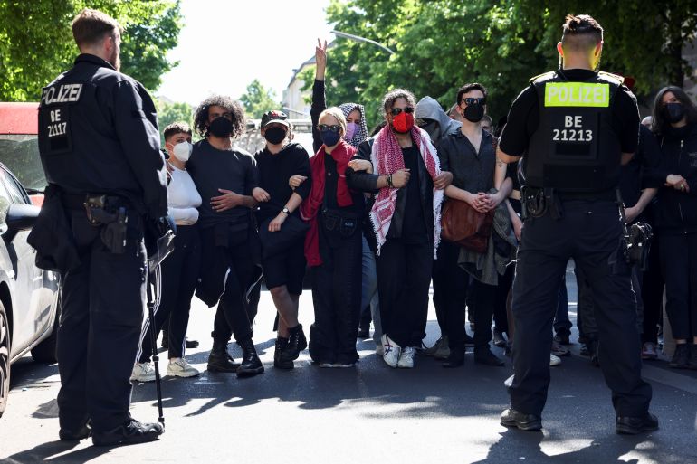 Police officers stand guard as people attend a demonstration to mark the Nakba and in support of Palestinians, in Berlin, Germany, May 15, 2022. REUTERS/Christian Mang
