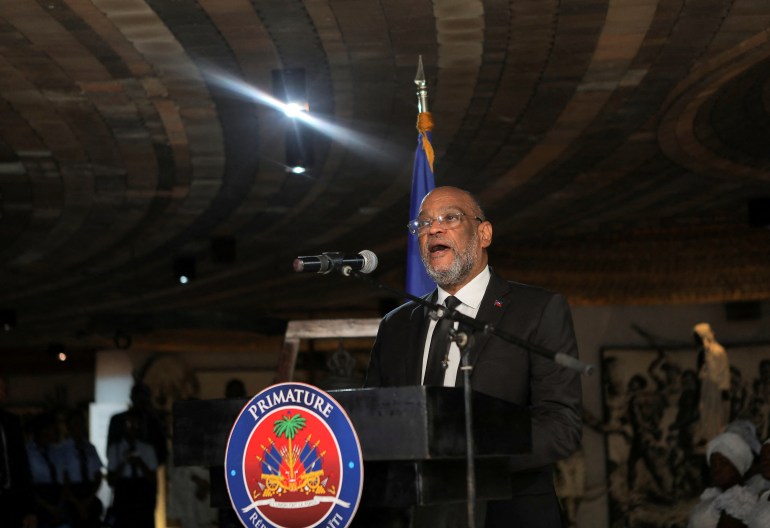 Haiti's Prime Minister Ariel Henry addresses the audience, during an event in commemoration of the 220th death anniversary of revolutionary leader Toussaint Louverture, in Port-au-Prince