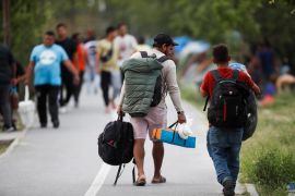 Asylum seekers hoping to get protection in US walk to an encampment in northern Mexico