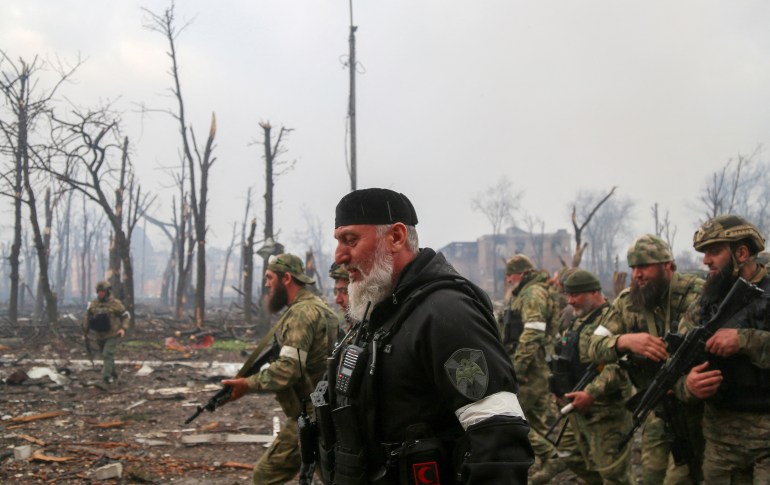 FILE PHOTO: Fighters of the Chechen special forces unit, led by Russia's State Duma member Adam Delimkhanov, walk near the administration building of Azovstal Iron and Steel Works during Ukraine-Russia conflict in the southern port city of Mariupol, Ukraine April 21, 2022. REUTERS/Chingis Kondarov/File Phot