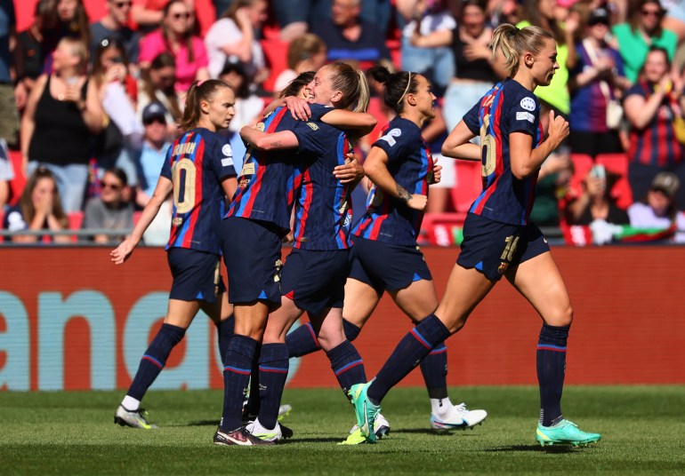 FC Barcelona's Patricia Guijarro celebrates scoring their second goal with Keira Walsh. [REUTERS/Yves Herman]