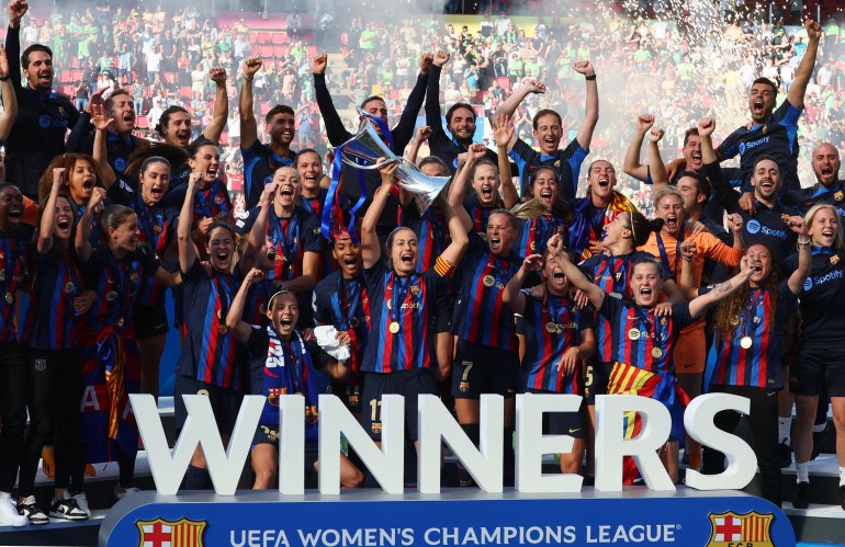 FC Barcelona's Alexia Putellas lifts the trophy with teammates after winning the Women's Champions League final. [REUTERS/Yves Herman]