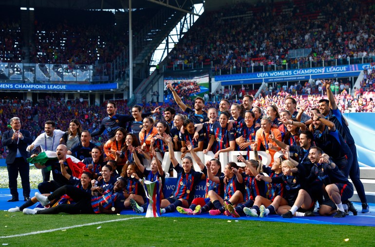 FC Barcelona pose with the trophy after winning the Women's Champions League. [REUTERS/Piroschka Van De Wouw]