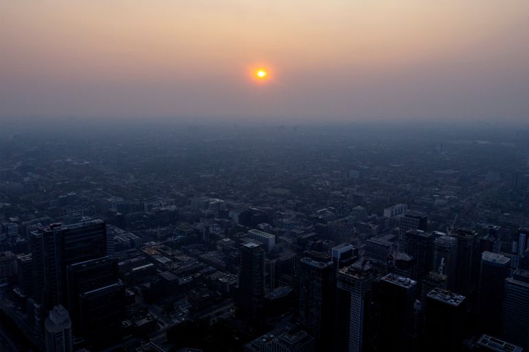 A smoky Toronto skyline is seen with a blanket of smoke due to wildfires