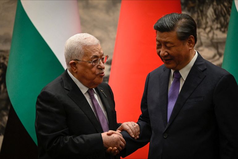 Palestinian President Mahmud Abbas talks to China's President Xi Jinping after a signing ceremony at the Great Hall of the People in Beijing, China June 14, 2023