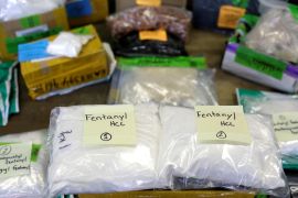 Clear bags carrying white powder are seen with a handwritten label saying "fentanyl"