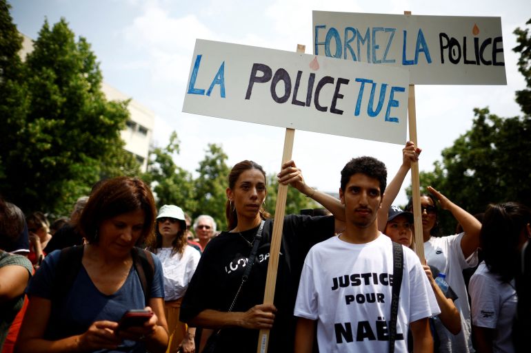 People attend a march in tribute to Nahel, a 17-year-old teenager killed by a French police officer during a traffic stop, in Nanterre, Paris suburb, France