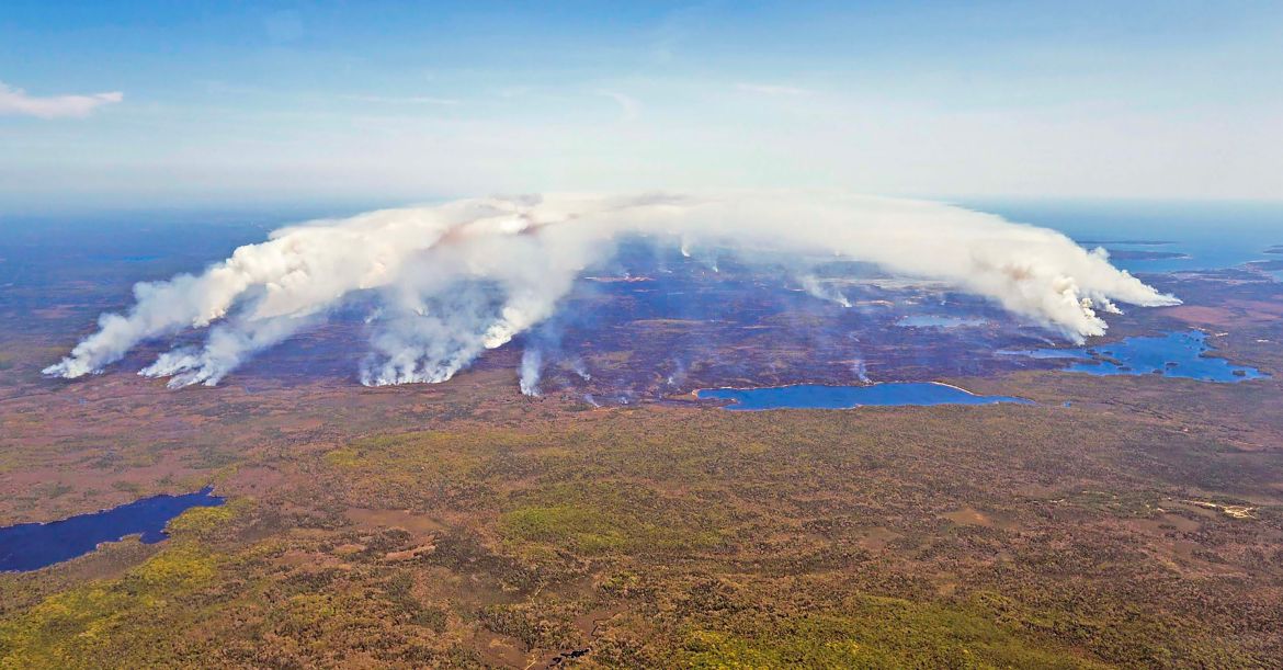 This May 31, 2023, aerial image courtesy of the Nova Scotia Government in Canada, shows the magnitude of the fire in Shelburne County.