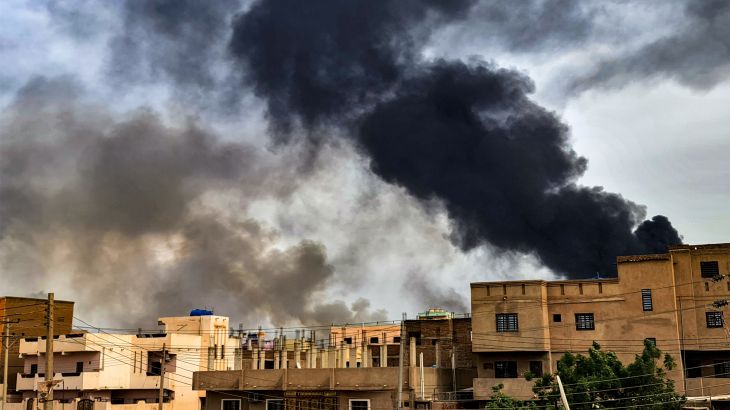 Smoke billows from a fire at a lumber warehouse in southern Khartoum [AFP]