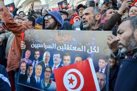 People take part in a protest against president Kais Saied policies, in Tunis, Tunisia, Sunday, March 5, 2023.