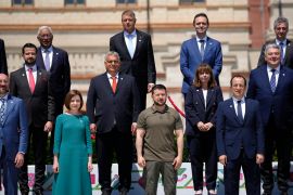 Front row left, to right, European Council President Charles Michel, Moldova's President Maia Sandu, Ukraine's President Volodymyr Zelenskyy and Cypriot President Nikos Christodoulides pose on the podium at a group photo during the European Political Community Summit at the Mimi Castle in Bulboaca, Moldova, Thursday, June 1, 2023. Leaders are meeting in Moldova Thursday for a summit aiming to show a united front in the face of Russia's war in Ukraine and underscore support for the Eastern European country's ambitions to draw closer to the West and keep Moscow at bay. (AP Photo/Andreea Alexandru)