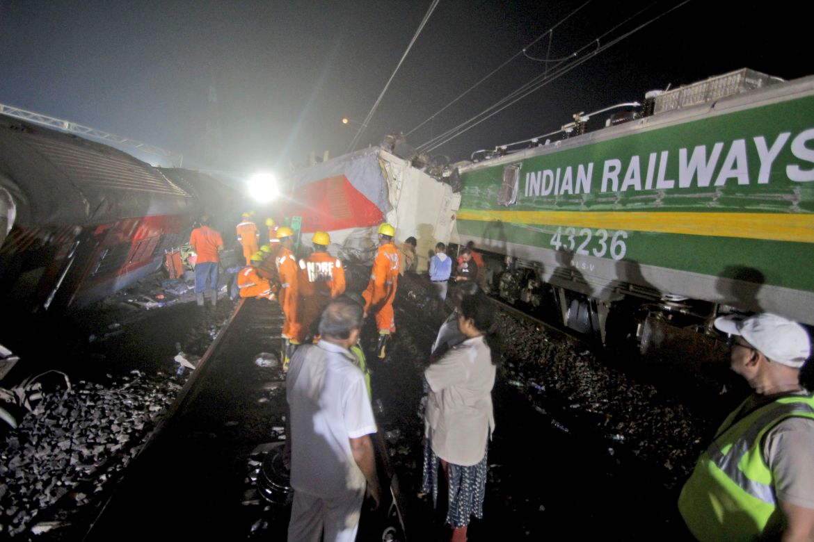 Rescuers work at the site of passenger trains accident in Balasore district