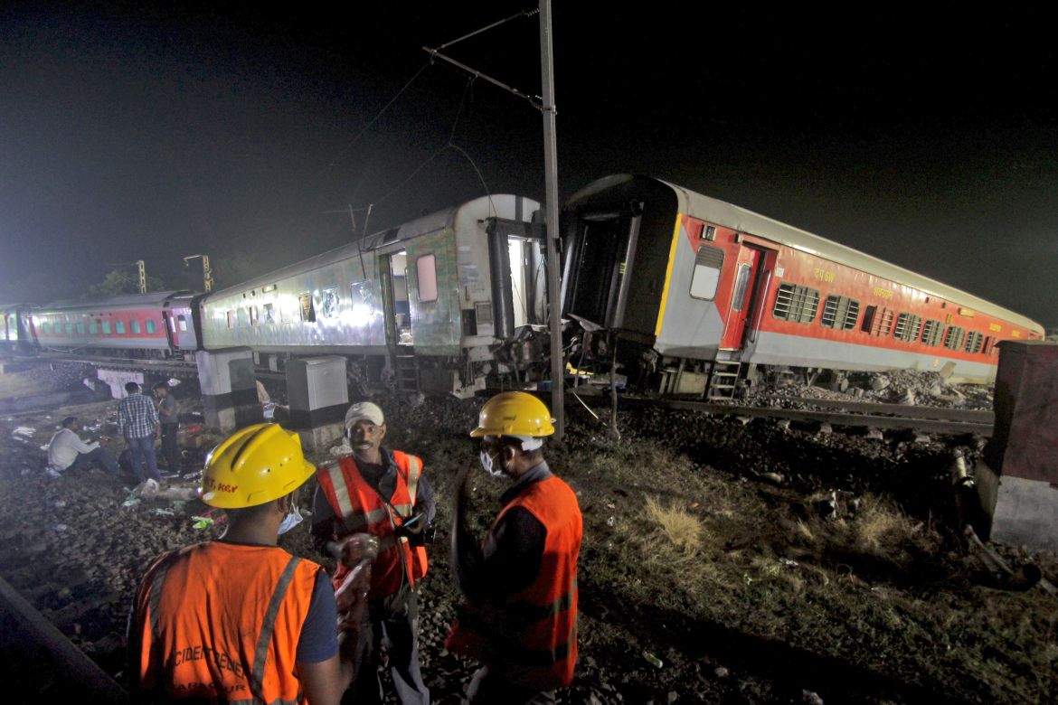 Rescuers work at the site of passenger trains accident in Balasore district