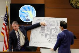 Using a diagram of the school, Coral Springs officer Jeffrey Heinrich (left) speaks about his understanding of the gunman&#39;s location during the 2018 shooting at Marjory Stoneman Douglas High School, June 8, 2023 [Amy Beth Bennett/South Florida Sun-Sentinel/Pool via AP Photo]