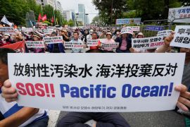 South Korean fishermen stage a rally against the planned release of treated radioactive water from the wrecked Fukushima nuclear power plant, in front of the National Assembly in Seoul, South Korea, Monday, June 12, 2023.
