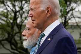 Seen in profile, Biden and Modi stand side by side