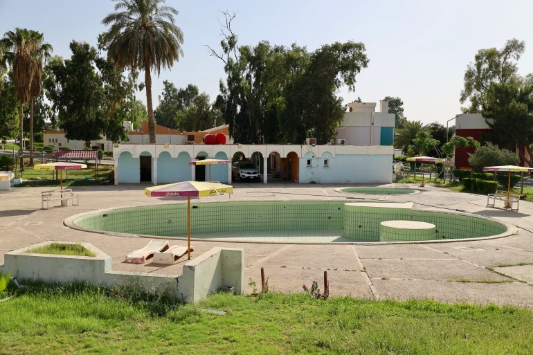 An abandoned swimming pool in the tourist resort on the receding shore of Habbaniyah Lake.