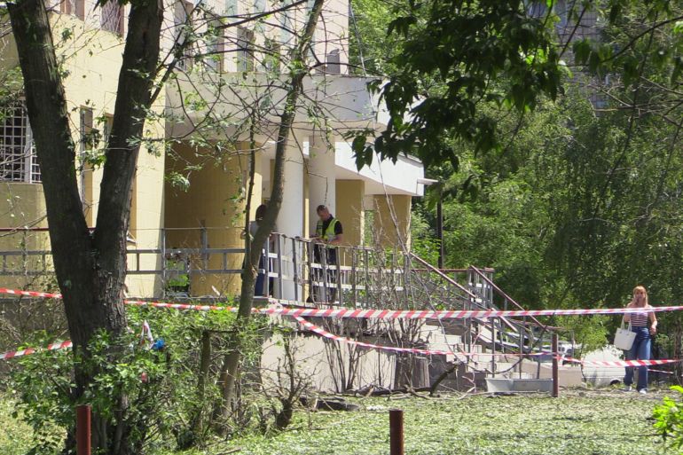 The debris of a Russian cruise missile killed three people who were trying to get into this bomb shelter on early Wednesday-