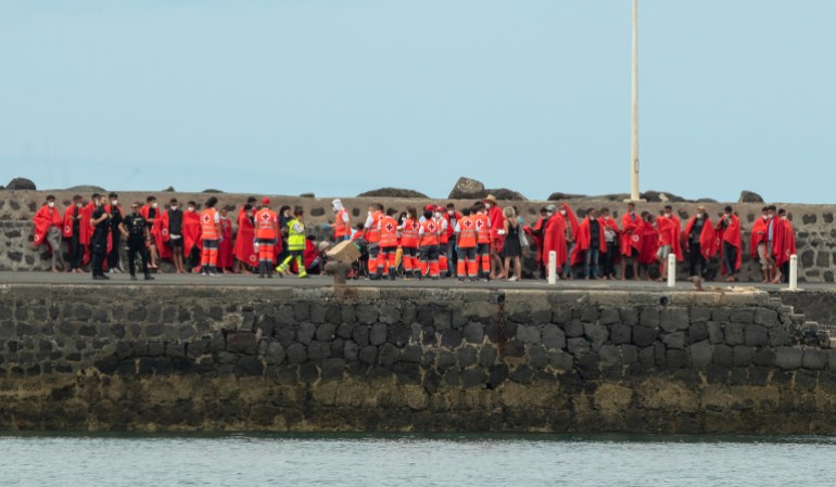A group of 51 migrants arrive to Arrecife port after they were rescued from a boat at sea, in Lanzarote, Canary Islands, Spain