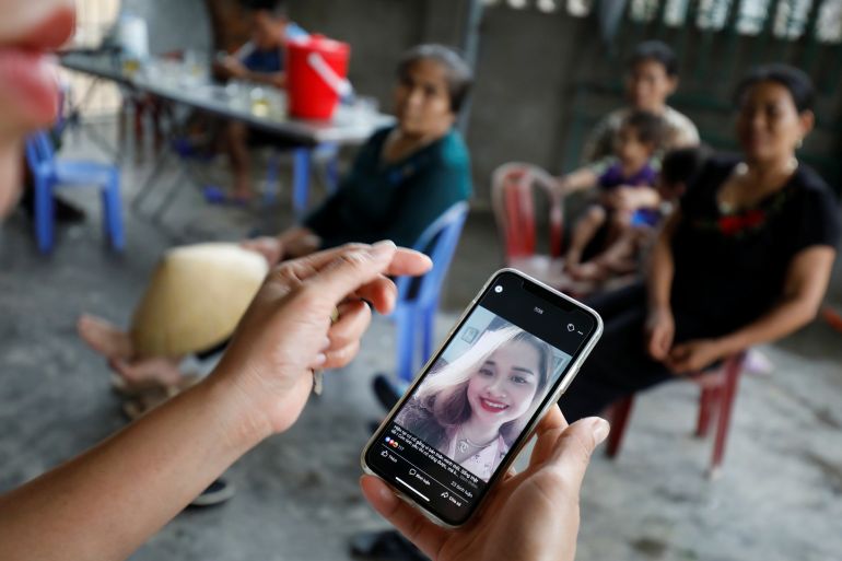 A relative looks at an image of Anna Bui Thi Nhung, a victim who was found dead in the back of British truck last month, at her home in Nghe An province, Vietnam October 26, 2019. Picture taken October 26, 2019. REUTERS/Kham