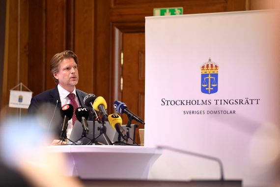 Judge Mans Wigen during a news conference after the verdict in a Stockholm district court