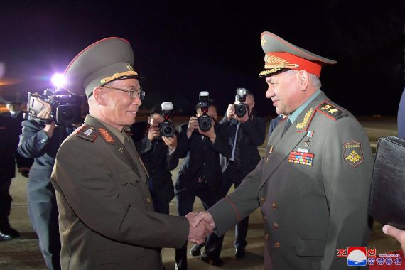 Russian Defence Minister Sergei Shoigu, who is leading a visiting delegation, is welcomed at an airport in Pyongyang, North Korea, July 25, 2023, in this image released by North Korea's Korean Central News Agency.