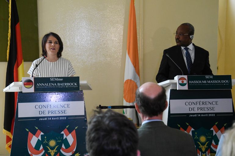 German Foreign Minister Annalena Baerbock (L) speaks during a joint press conference with Niger's Chief of Diplomacy Hassoumi Massoudou (R) in Niamey on April 14, 2022