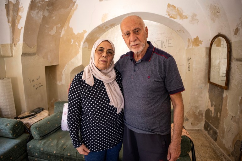 Nora (L) and Mustafa Sub Laban posing for a picture at their home in Jerusalem's old city