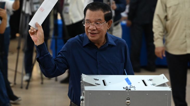 Cambodia's Prime Minister Hun Sen prepares to cast his vote at a polling station in Kandal province on July 23