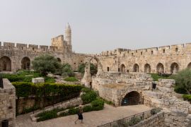 A woman walks at the inner courtyard of the Tower of David Museum in Jerusalem&#39;s Old City on Monday, May 22, 2023. The museum has long been accused of systematically effacing its Islamic and Palestinian heritage [Ohad Zwigenberg/AP Photo]
