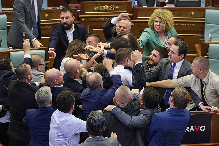 Lawmakers push each other as a brawl breaks out in Kosovo's parliament