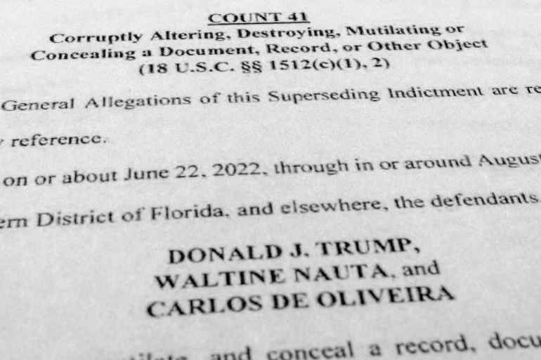 A document showing new counts against Donald J Trump, Waltine Nauta and Carlos de Oliveira.
