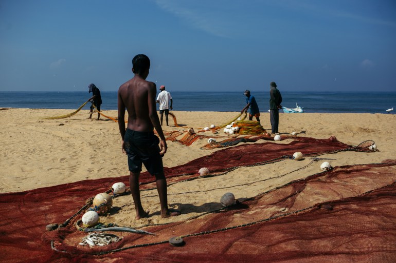 Boys managing the beach seine nets after hauling in the day's catch by Negombo Lagoon, which was quite poor that day