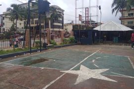 A white star painted on a basketball court in the compound of St Peter&#39;s Lutheran Church in Monrovia, Liberia, indicates where victims of the first Liberian war were buried in mass graves. [Courtesy of Robtel Neajai Pailey]