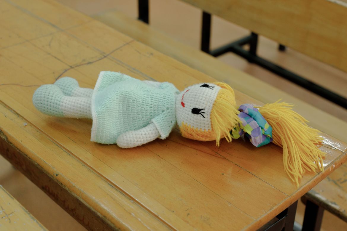 Sare's stuffed doll lays on the desk of her classroom at Lions Ilkokulu in Gaziantep