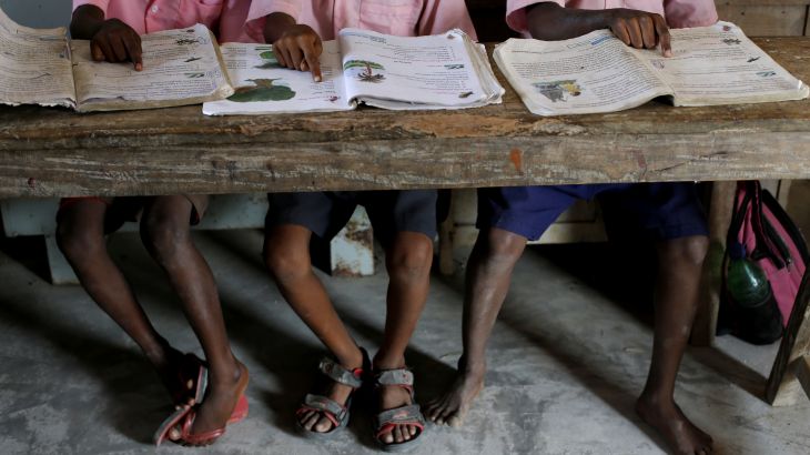 Students from a primary school read books inside a classroom on Ghoramara Island, India, November 16, 2018. Ghoramara Island, part of the Sundarbans delta on the Bay of Bengal, has nearly halved in size over the past two decades, according to village elders.