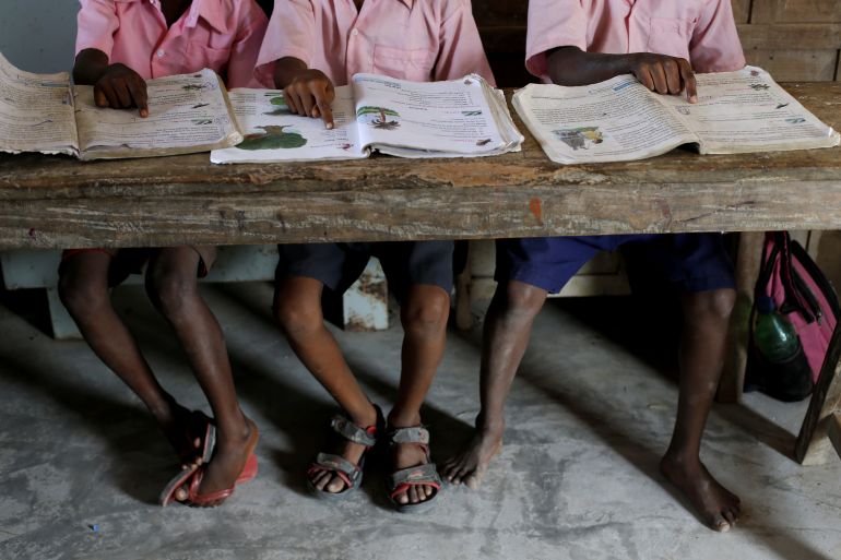 Students from a primary school read books inside a classroom on Ghoramara Island, India, November 16, 2018. Ghoramara Island, part of the Sundarbans delta on the Bay of Bengal, has nearly halved in size over the past two decades, according to village elders.