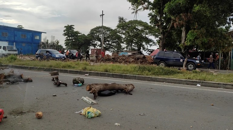 Debris is seen on a highway, after protests against the government in Honiara, Solomon Islands, November 24, 2021, in this screen grab obtained by Reuters from social media video. Georgina Kekea via REUTERS THIS IMAGE HAS BEEN SUPPLIED BY A THIRD PARTY. MANDATORY CREDIT.