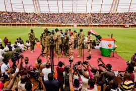 Supporters of Niger's coup leaders take part in a rally at a stadium in Niamey, Niger