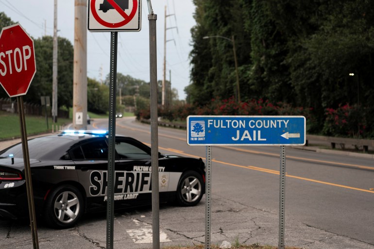 A sign directs traffic to the Fulton County Jail, in Atlanta, Georgia, US